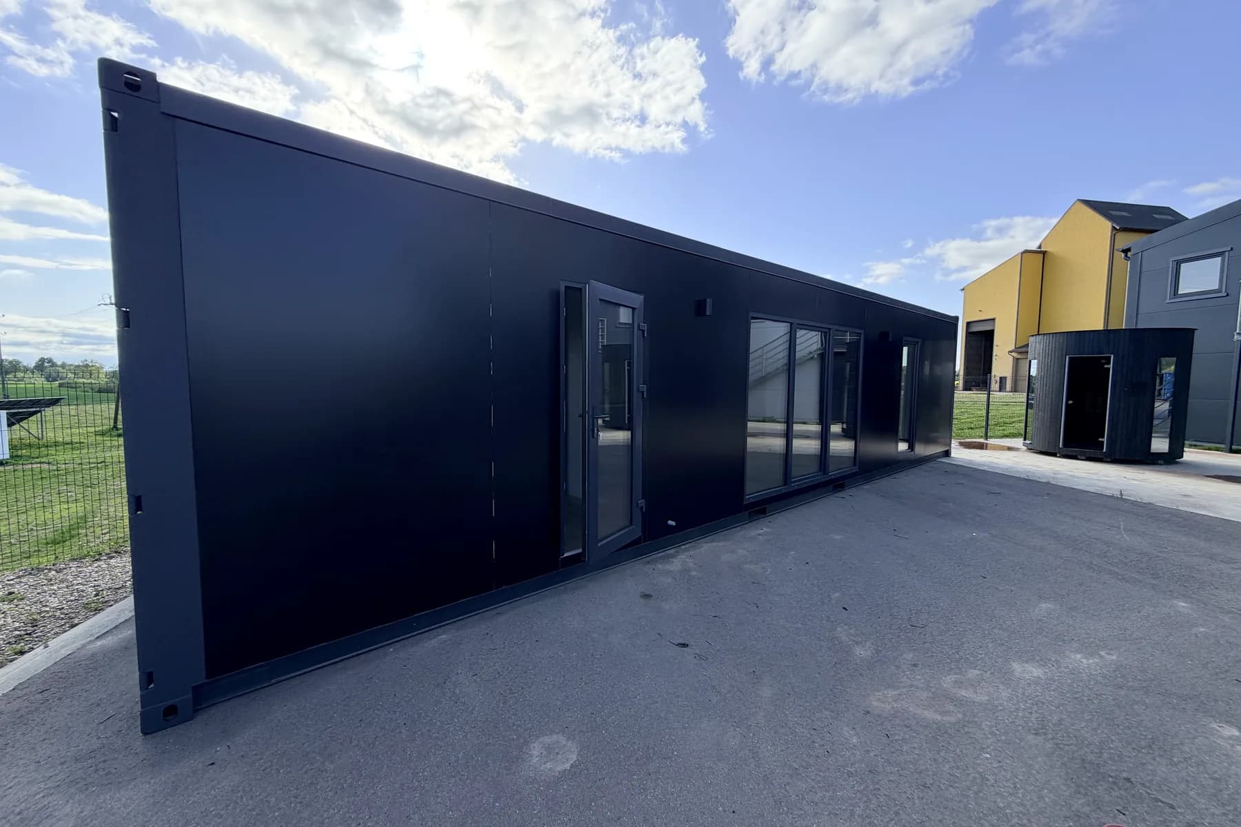 Side view of a MARA NORD modular building at the showroom — 1